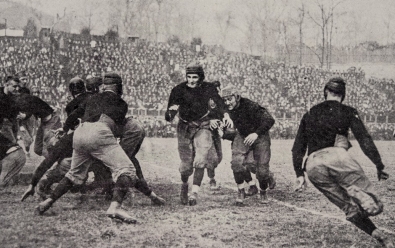 A vintage photo of a University of Cincinnati football game that features the namesake of UC's mascot, Teddy Baehr.