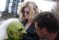 University of Cincinnati alum Cara Sullivan is shown working on the crazy white hair of an actor in costume for the television show "Saturday Night Live."