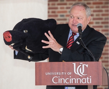 University of Cincinnati alumnus Tom Humes shows off his memento, the large head of his Bearcat costume.