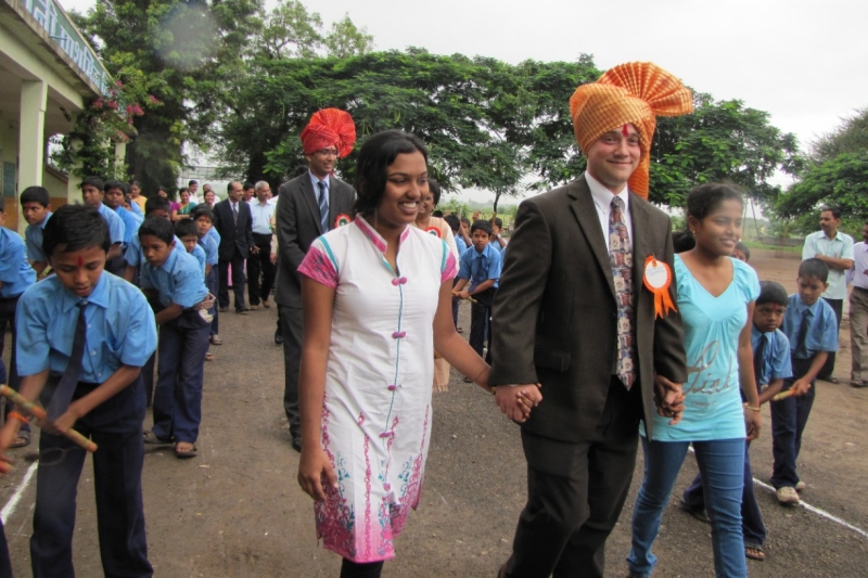 UC's Jon Weller walks hand in hand with Karishma Randhave and Anjani Lahane.