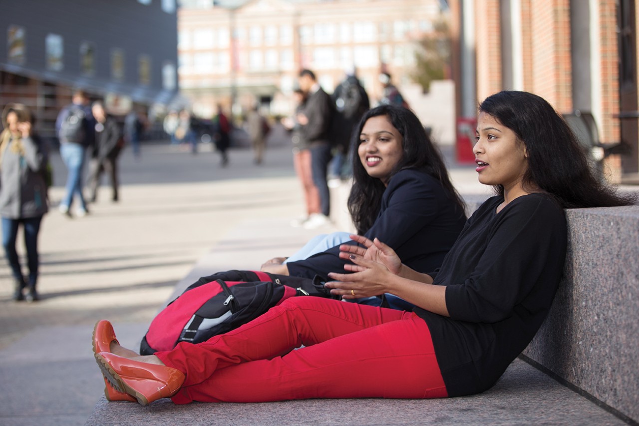 Anjani Lahane talks with Karishma Randhave along UC’s MainStreet.