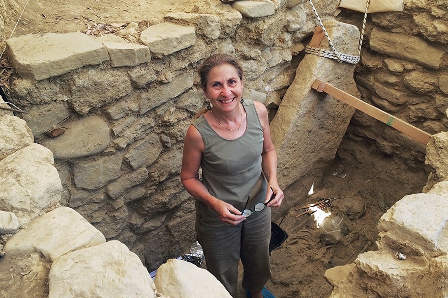 Archaeologist Sharon Stocker stands inside a tomb in Greece