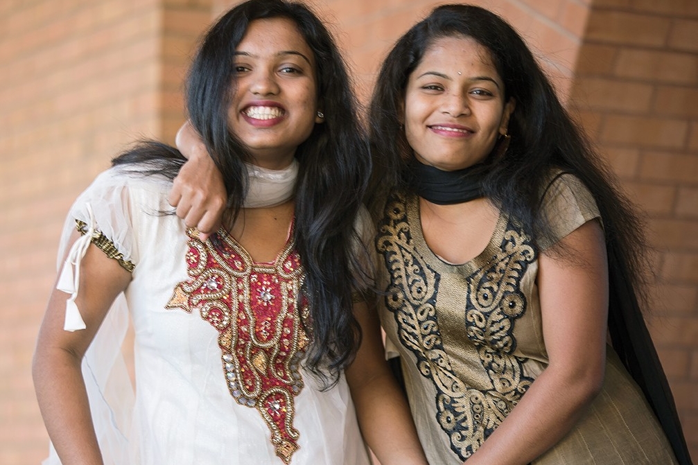 UC students Anjani Lahane and Karishma Randhave pose together.