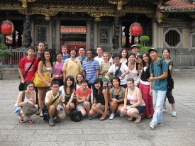 Tina Chen (far left, holding yellow bag) with her peers from National Chengchi University during her study abroad experience in Taiwan.