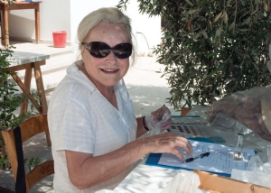  Gisela Walberg catalogs shards under an Olive tree. 