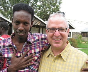    Drama professor Richard Hess led a contingent of students to Kenya last summer where they met refugees such as Abdi Rashid, a writer, who translated Hess' words to Somali. 