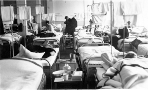This 60-bed ward was located next to surgery, according to an unknown photographer who wrote on the back of the photo. "It was ideal for sorting and shock treatment of acute cases prior to surgery." 
