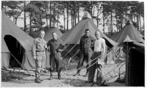 In June 1944, these doctors -- Edward "Red" Elsey, Dudley "Doug" Wolfe, Max Haas and James "Jimmy" Mack (in unknown order) -- waited in North Tidworth, England, to be transferred to Europe after D-Day.   Setting up 529 tents on concrete bases to form a hospital in Lison, France, became difficult in August 1944 when continual rain created so much mud that trucks became trapped. 