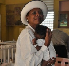 Pamela Bridgewater cuddles Jamaican infant