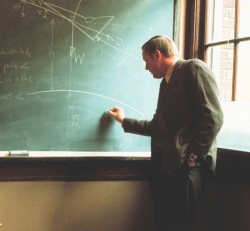 Neil Armstrong drawing lessons on a blackboard