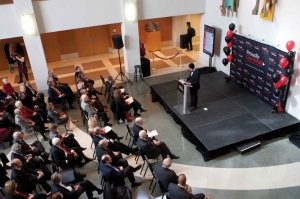 An aerial view of a crowded room during the annoucement