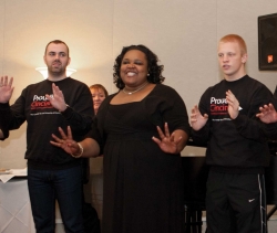 Three students singing.