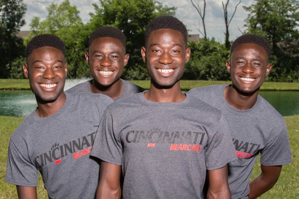 The Mantey brothers - two sets of identical twins from the same family - pose in their UC gear