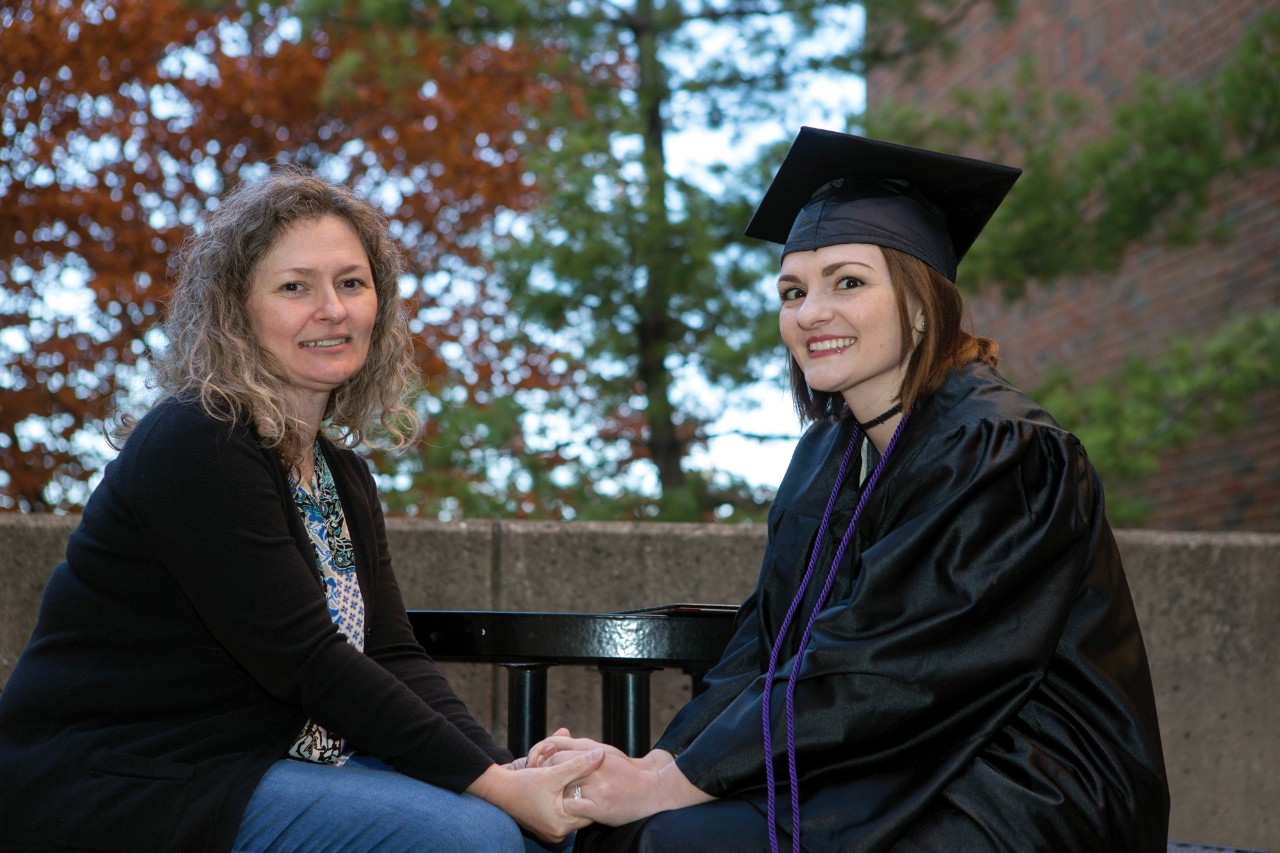 Tori Thomas and her mom, Melissa Caldwel sit outside UC's Geo-Physics building.