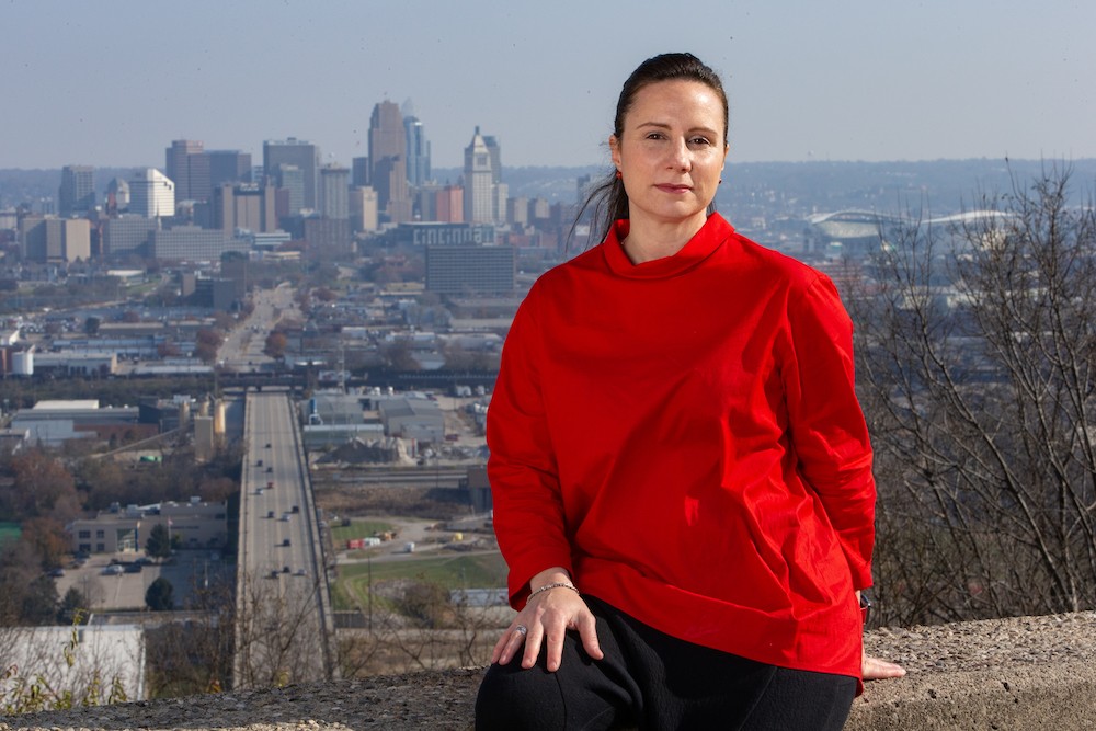 DAAP Associate Professor Claudia Rebola stands near an overlook of the city of Cincinnati