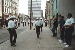 Armed police patrolling Over-the-Rhine to quell racial riots brought Cincinnati and its mayor into the national spotlight one year ago. photo/Carrie Cochran/The News Record