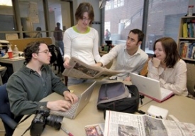 The News Record office has moved around to at least five different locations since the '70s, but in 2004, staff members moved into quarters especially designed for them in Swift Hall, complete with wireless Internet access. Staff members in the spring of 2006 include, from left to right, photo editor Dan Burns, editor-in-chief Julie Hollyday, managing editor Michael Rovito and entertainment editor Laura Sayer. photo/Andrew Higley 