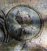 Alexander Goode's face, wearing his Army cap, was painted on bricks.