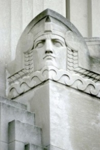 A stylized head created out of concrete is one of the features on Blegen Library.
