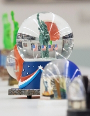 A close-up of a Statue of Liberty snow globe displayed in the University of Cincinnati's DAAP library.