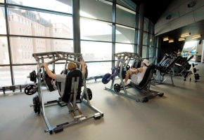 A few students make use of the fitness machines at the Campus Recreation Center. The fitness floor boasts more than 200 machines and 21,000 pounds of free weights. 