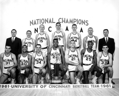 Team photo shows the 1961 UC bearcats basketball team with their coaches.