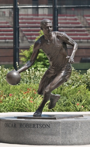 A statue of Oscar Robertson shows UC's legendary player dribbling the basketball.