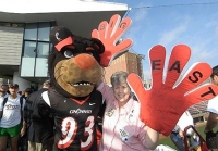 Bearcats fan Barb Cannon brought out her big hands for the Big East party July 1.  photo/Lisa Ventre 