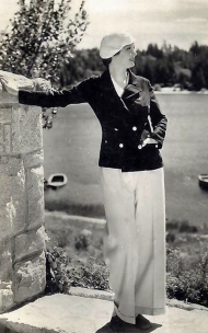Evelyn Venable, posed lakeside in a casual outfit