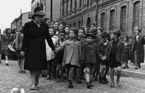 Children who survived the Holocaust in Czestochowa walking down the street.