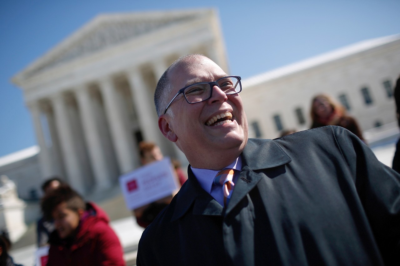 A smiling Jim Obergefell stands on the steps of the U.S. Supreme Court. Obergefell's case on same-sex marriage was brought to the court.