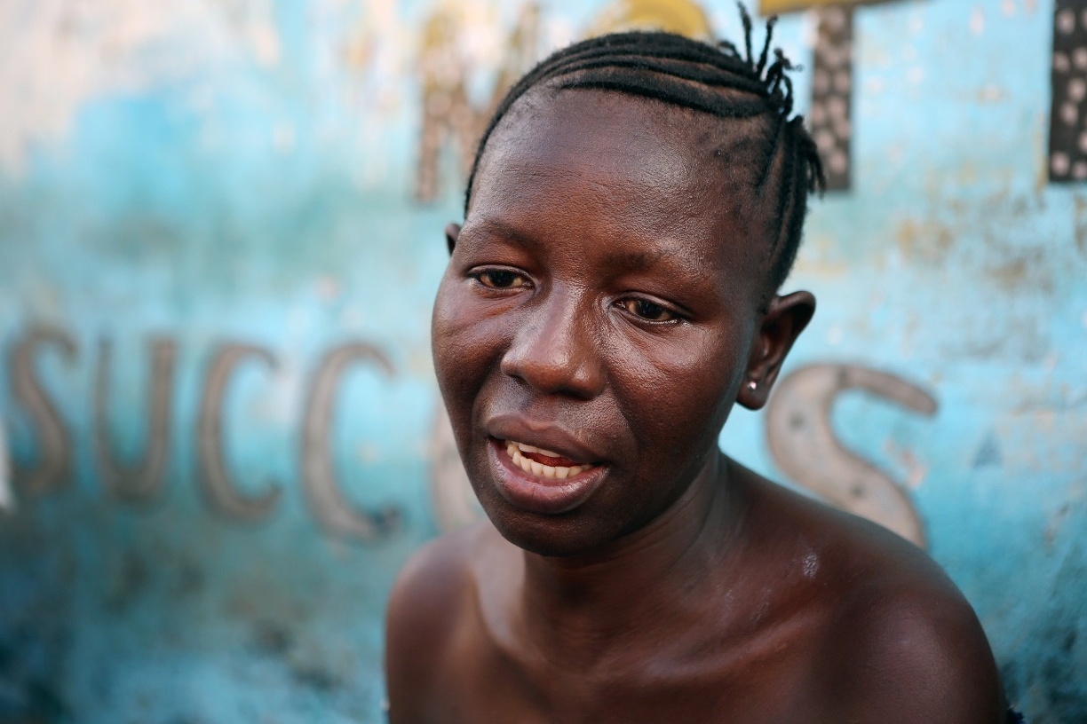 An Ebola survivor in Sierra Leone sits and shares her story.