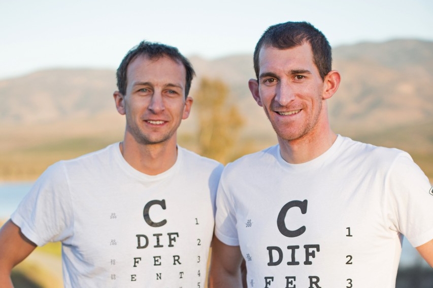 Aaron Sheidies and Colin Riley stand next to road in California wearing cdifferentwithaaron.com t-shirts.