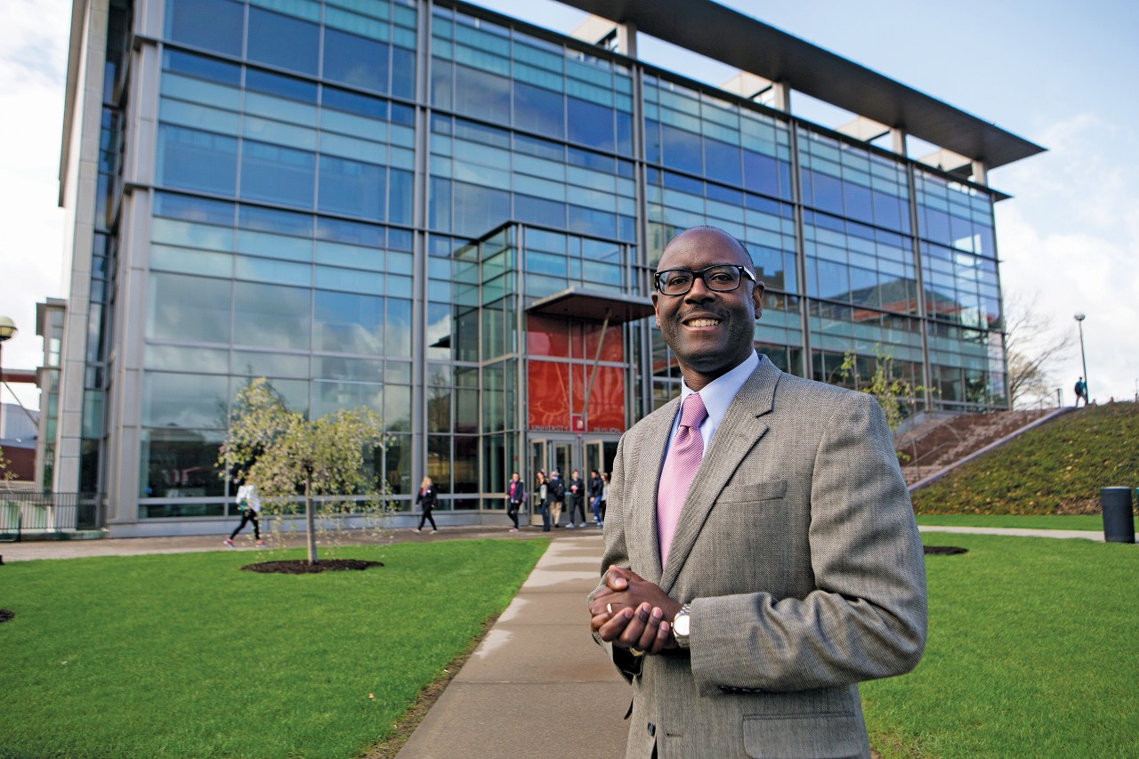 Terence Harrison stands in front of UC's University Pavilion.