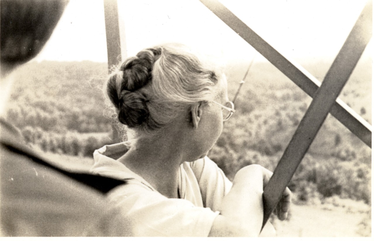 Lucy Braun looking out at trees from observation tower