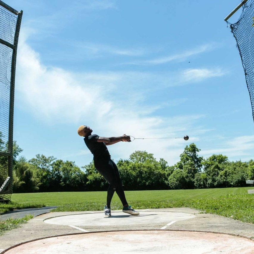 Echikunwoke demonstrates a hammer throw (2 of 3)