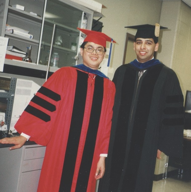 Neville Pinto and David Jen, both in commencement regalia