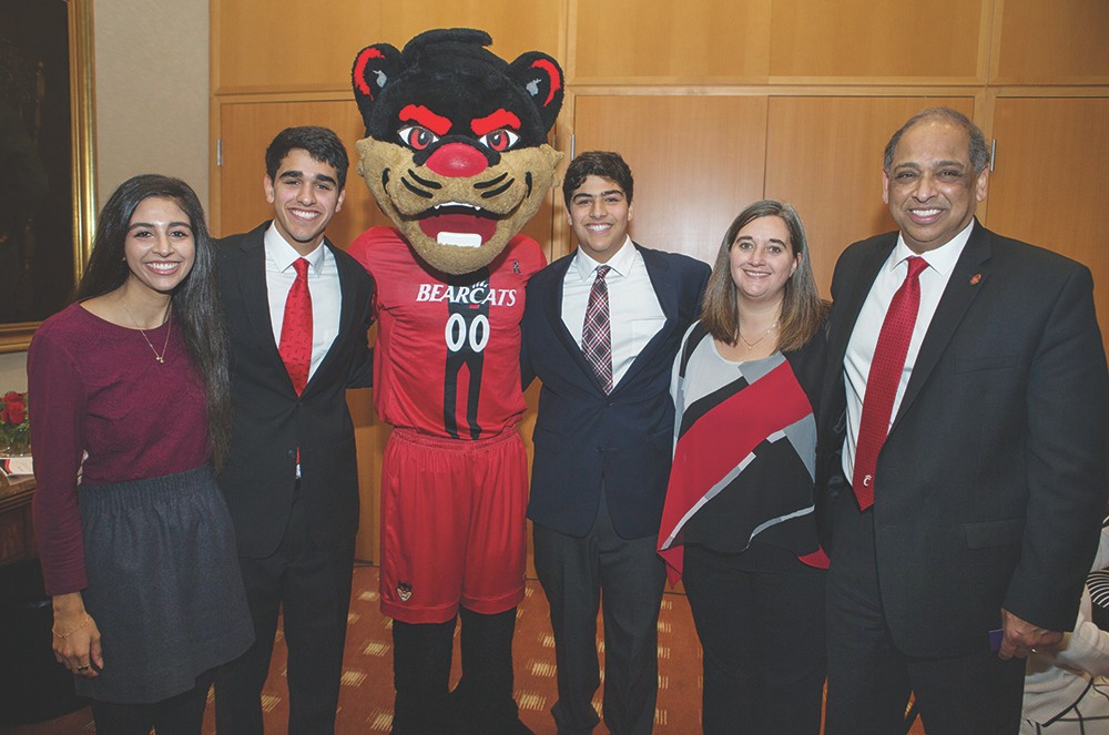 UC President Neville Pinto with his wife, three kids and the Bearcat mascot