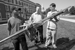 Rob Charvet, Cody Lafountain and Matt Finke hold a model airplane at UC.