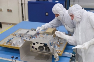 The scientific instruments aboard LCROSS are inspected. Landis' optics and spectrometer are included. 