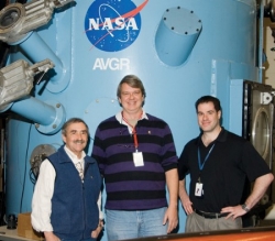 David Landis standing with LCROSS science team member Pete Schultz and NASA's Anthony Colaprete.