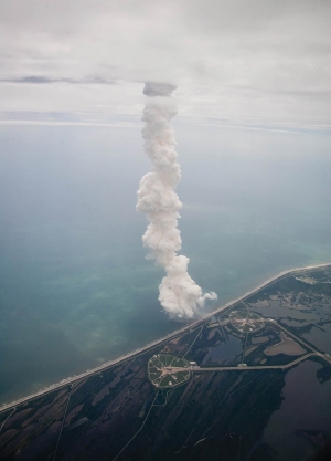The exhaust plume from launching the space shuttle Atlantis' final flight is seen from a Shuttle Training Aircraft on July 8 in Cape Canaveral, Fla.