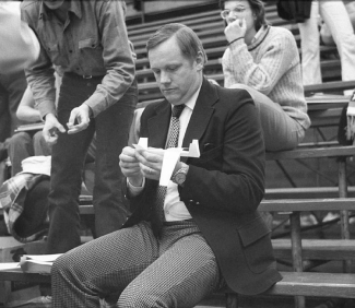 Neil Armstrong making a paper airplane.