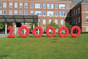 UC marked the reaching of 100,000 donors by spelling the milestone out with red balloons on McMicken Commons.