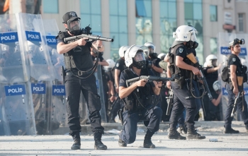 Police fire tear gas canisters at a group of protesters near Taksim Square on June 11