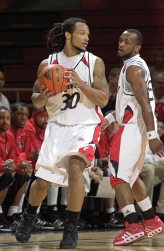 Cedric McGowan, handling the ball in the February '07 game against Rutgers, shows off today's typical attire of dual shorts. photo/Andrew Higley