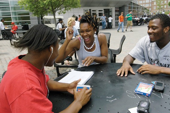 Although playing computer games might be more common than card games today, students still shuffle the decks, as these students prove, sitting outside TUC in the spring of '07. photo/Lisa Ventre