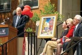 James Winkle makes a few light-hearted comments in June while saying thanks for the painting he was given in honor of his $10 million gift to the College of Pharmacy. Sitting, from left to right, are health-affairs provost Jane Henney, President Nancy Zimpher and pharmacy Dean Daniel Acosta.