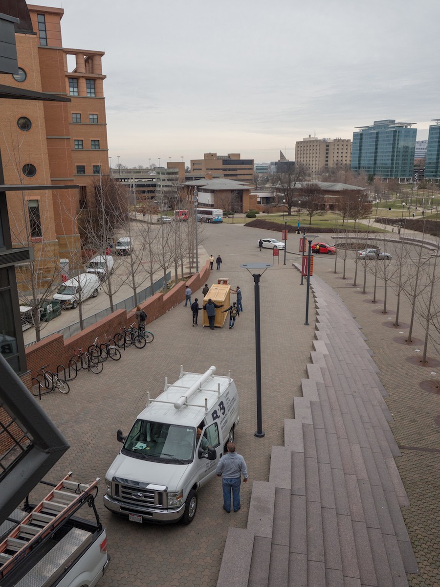 UC Hyperloop team escorts a crated Hyperloop prototype down UC's Mainstreet.