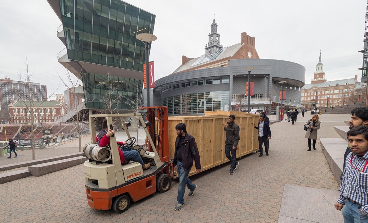 Hyperloop UC team members escort a crated protype across campus.